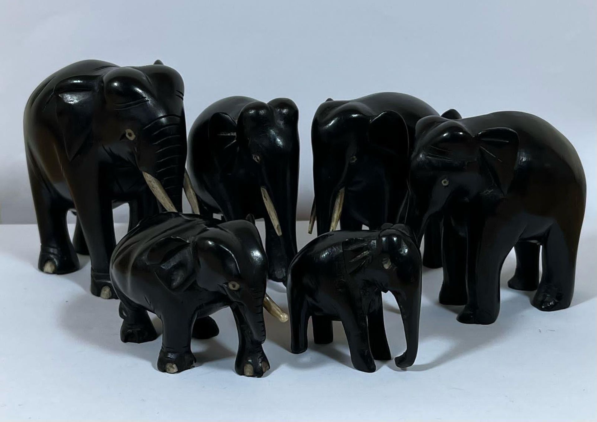 AN ANTIQUE GROUP OF SIX EBONY ELEPHANTS, LARGEST 9CM HEIGHT