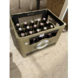 A WARSTEINER BEER CRATE AND 20 GLASS BOTTLES