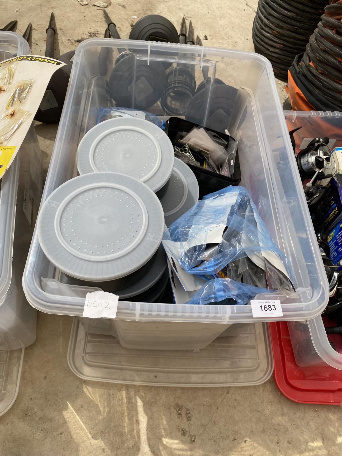 A BOX OF ASSORTED FISHING TACKLE TO INCLUDE HOOKS, BAIT TUBS AND FEEDERS ETC (FROM A TACKLE SHOP
