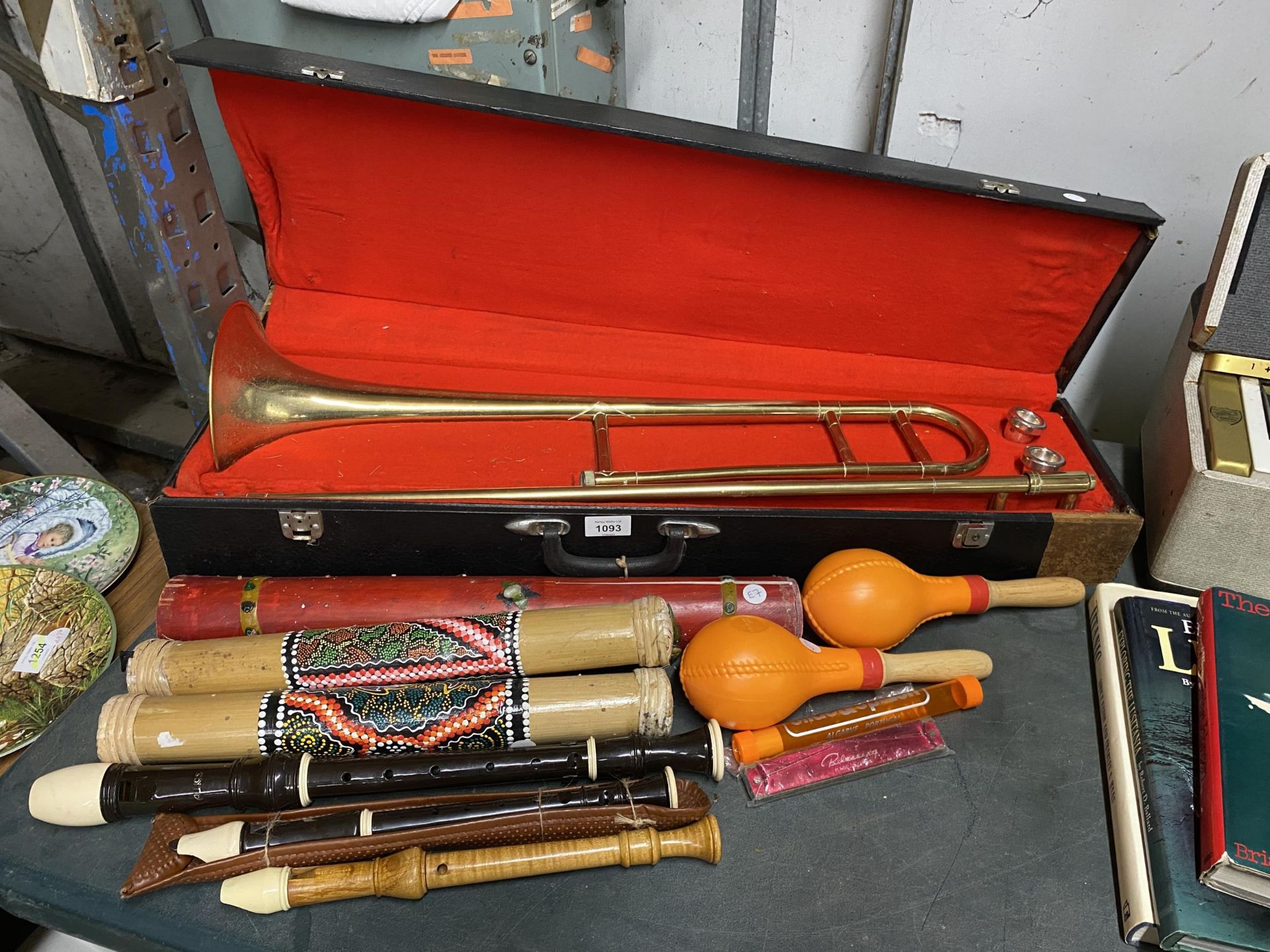 A MIXED LOT OF MUSICAL ITEMS, CASED MELODY BRASS TRUMPET, SHAKERS, FLUTES ETC