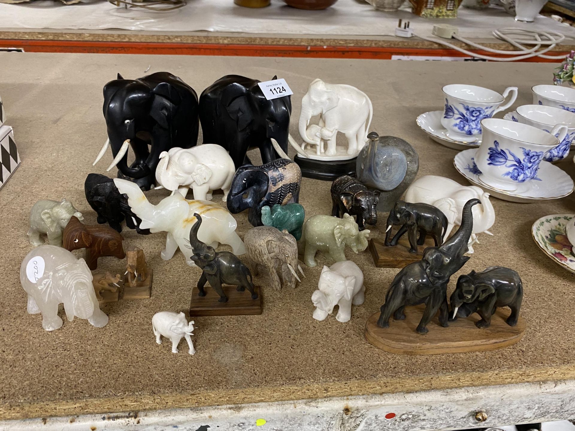 A COLLECTION OF ELEPHANTS TO INCLUDE EBONY AND HARDSTONE EXAMPLES ETC
