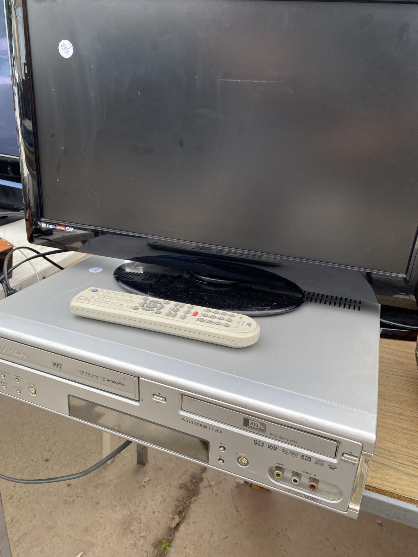 A 22" TELEVISION AND A DAEWOO VHS/DVD PLAYER - Image 2 of 2