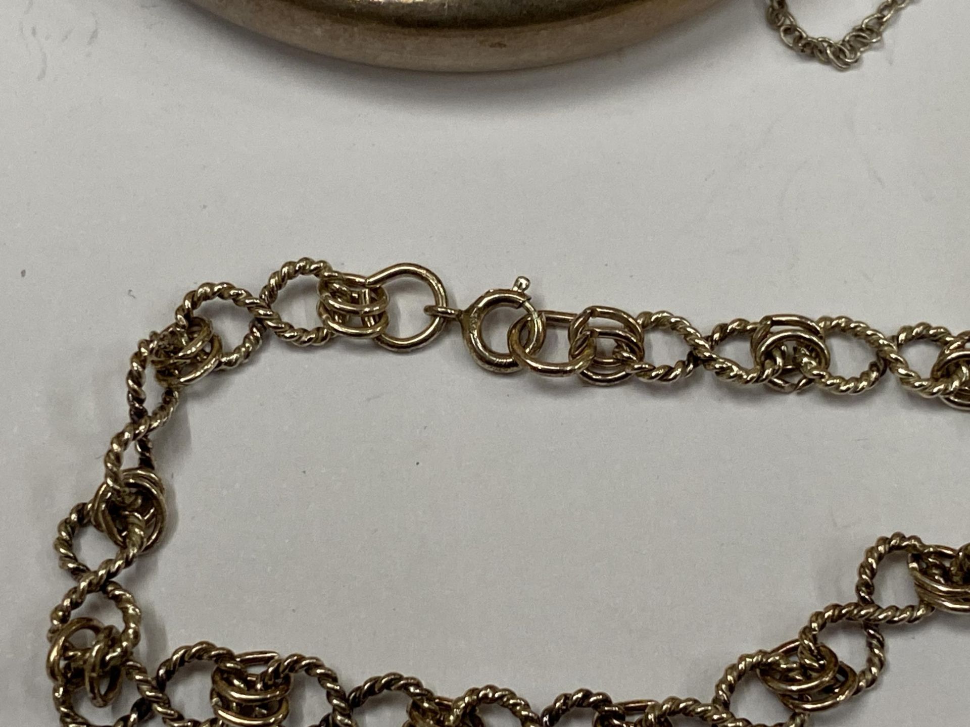 TWO SILVER BRACELETS TO INCLUDE HALLMARKED CHILD'S BANGLE AND OTHER DECORATIVE EXAMPLE - Image 3 of 3