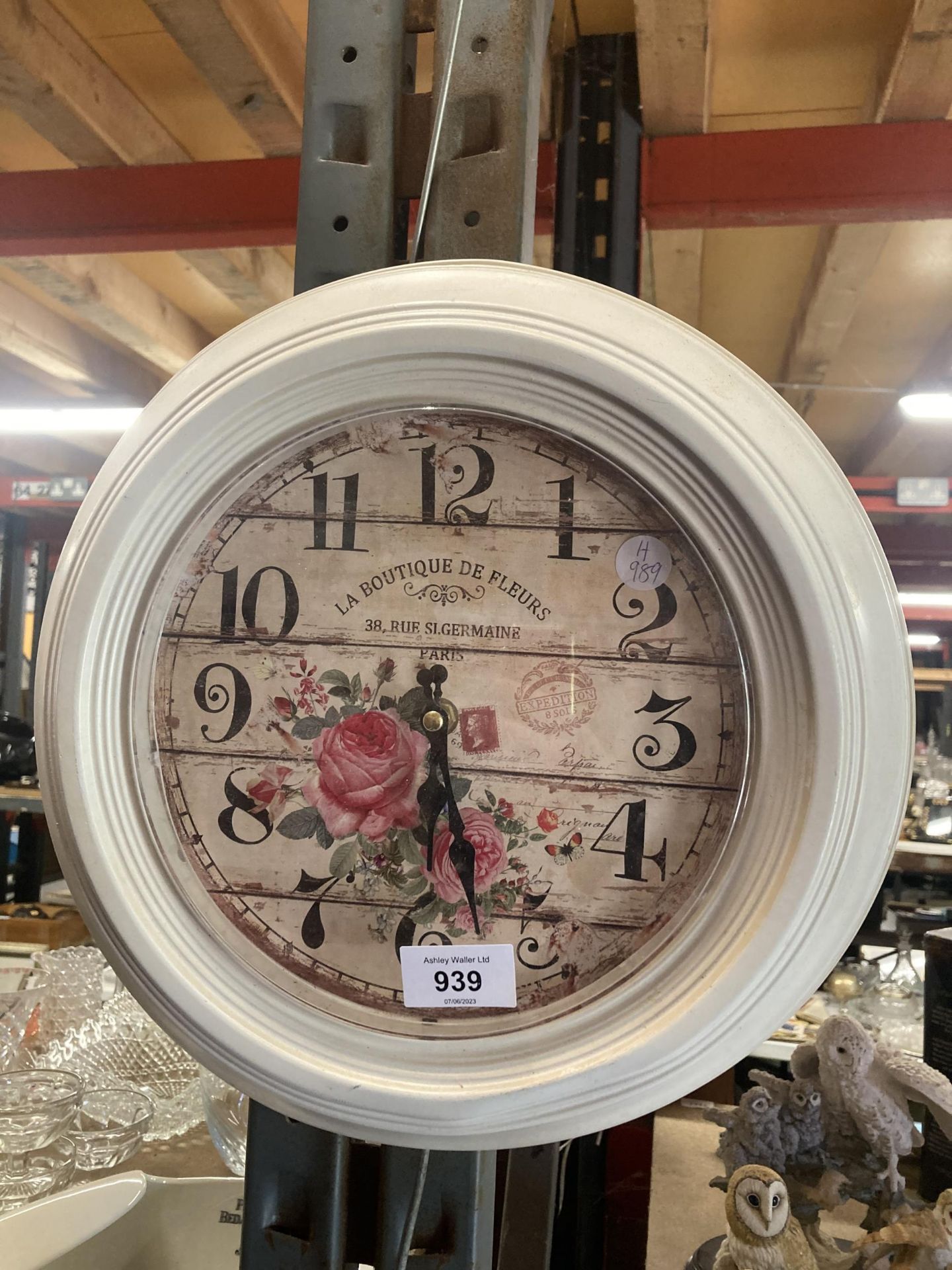 A VINTAGE STYLE 'LA BOUTIQUE DE FLEURS' WALL CLOCK