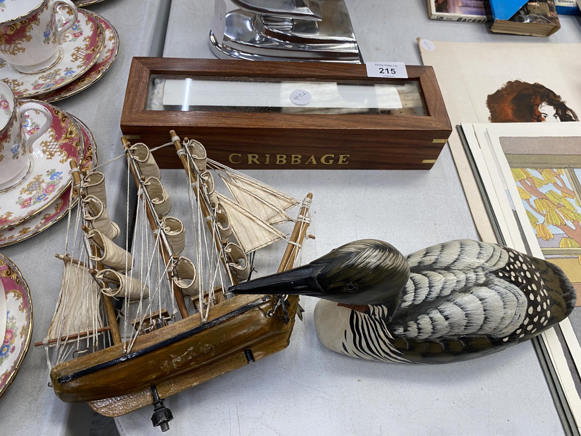 A WOODEN CRIBBAGE SET TOGETHER WITH A WOODEN DUCK AND SHIP