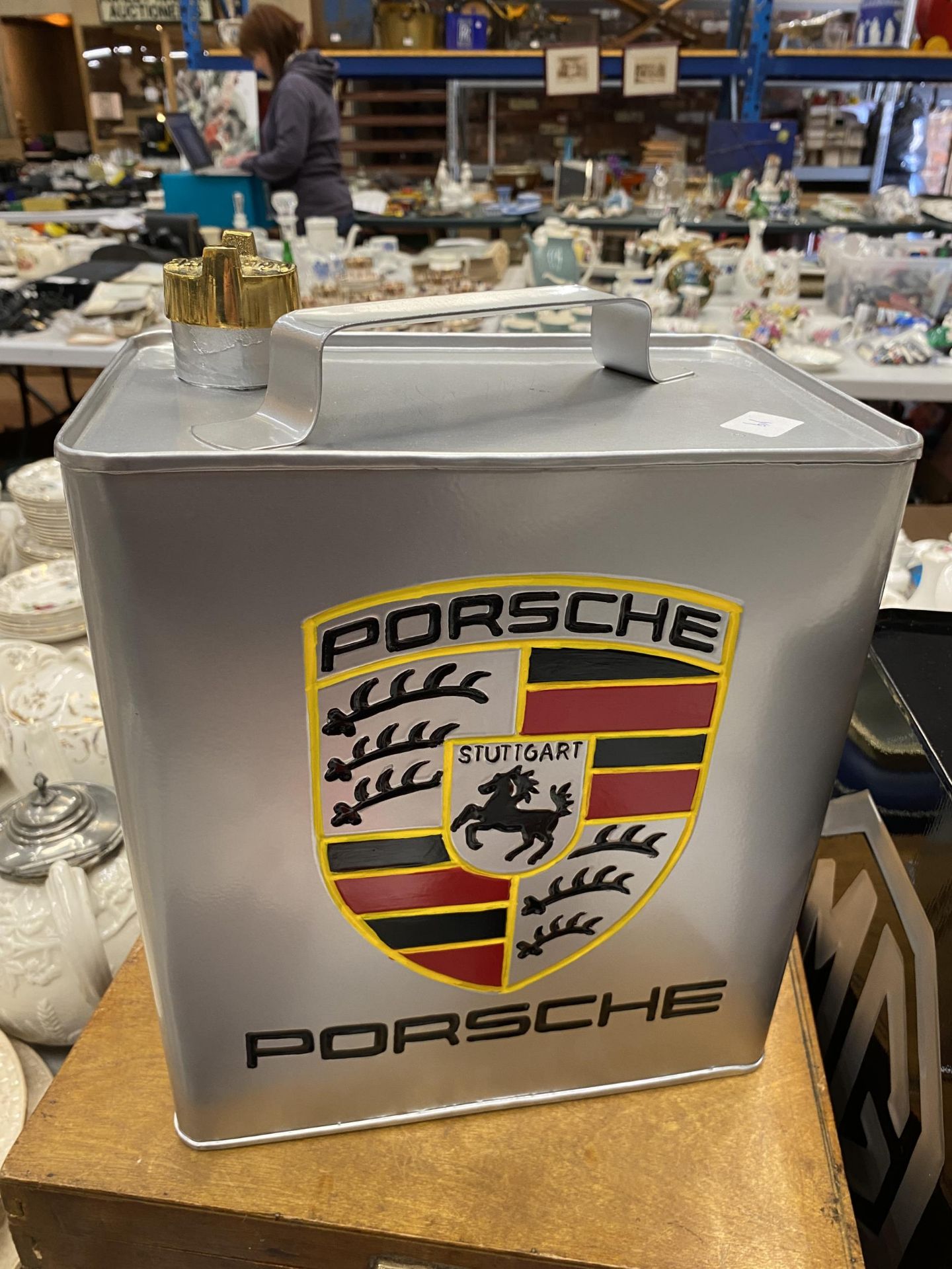 A SILVER COLOURED PORSCHE PETROL CAN