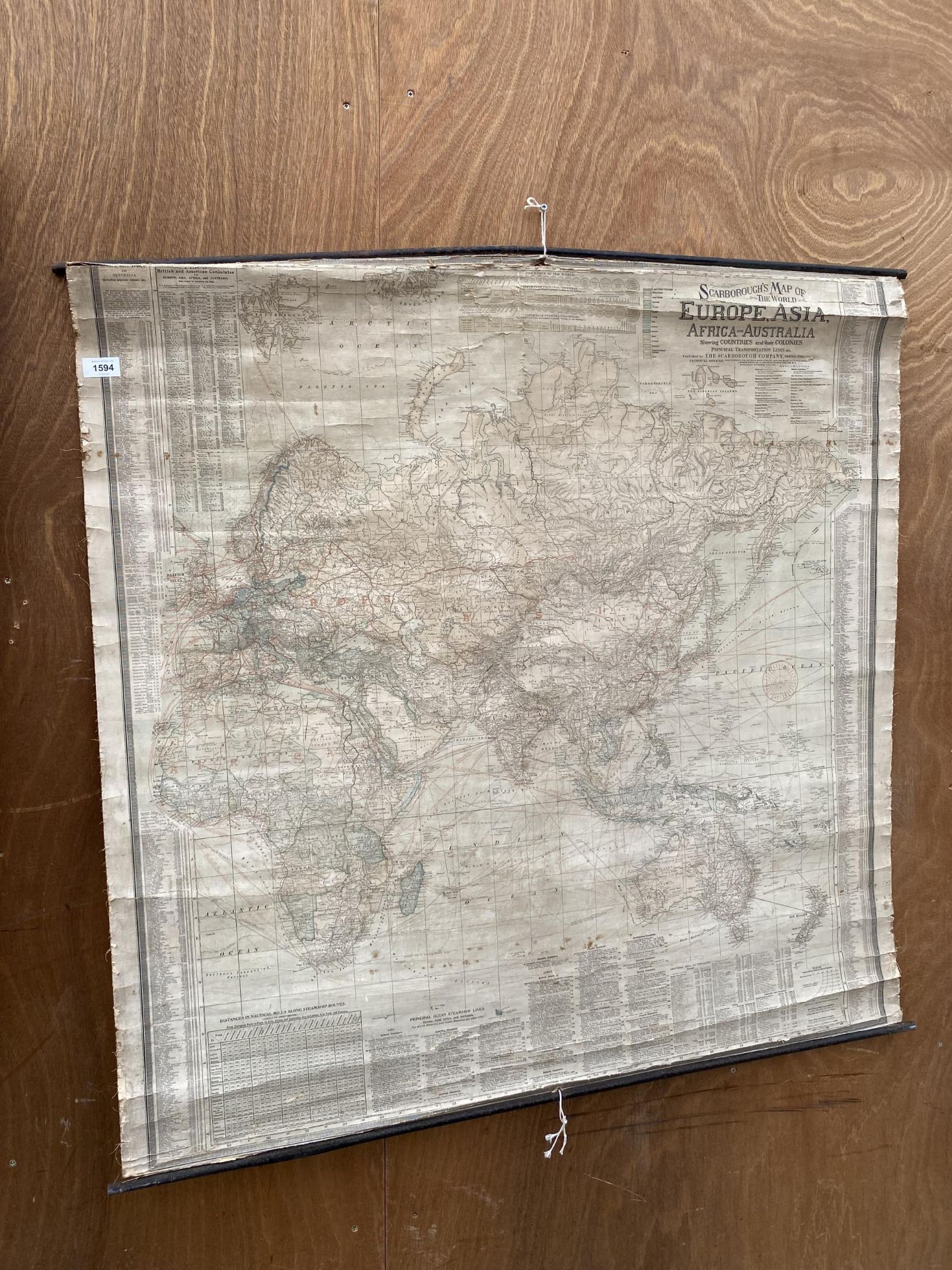 A VINTAGE SCROLL MAP OF EUROPE, ASIA, AFRICA AND AUSTRALLIA