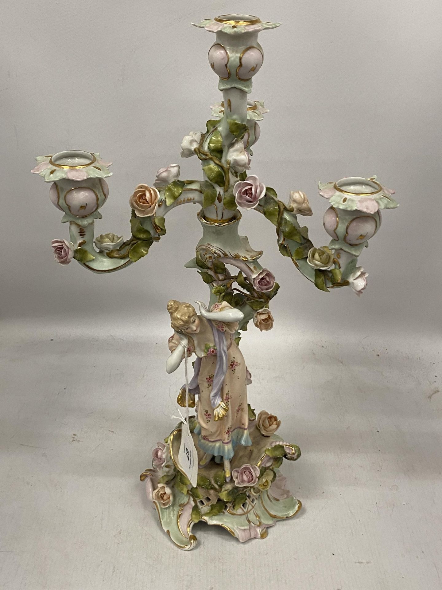 A DRESDEN CONTINENTAL HARD PASTE PORCELAIN CHERUB THREE BRANCH CANDLESTICK, HEIGHT 45CM