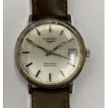 A VINTAGE LONGINES CONQUEST AUTOMATIC WRIST WATCH WITH LEATHER STRAP SEEN WORKING BUT NO WARRANTY