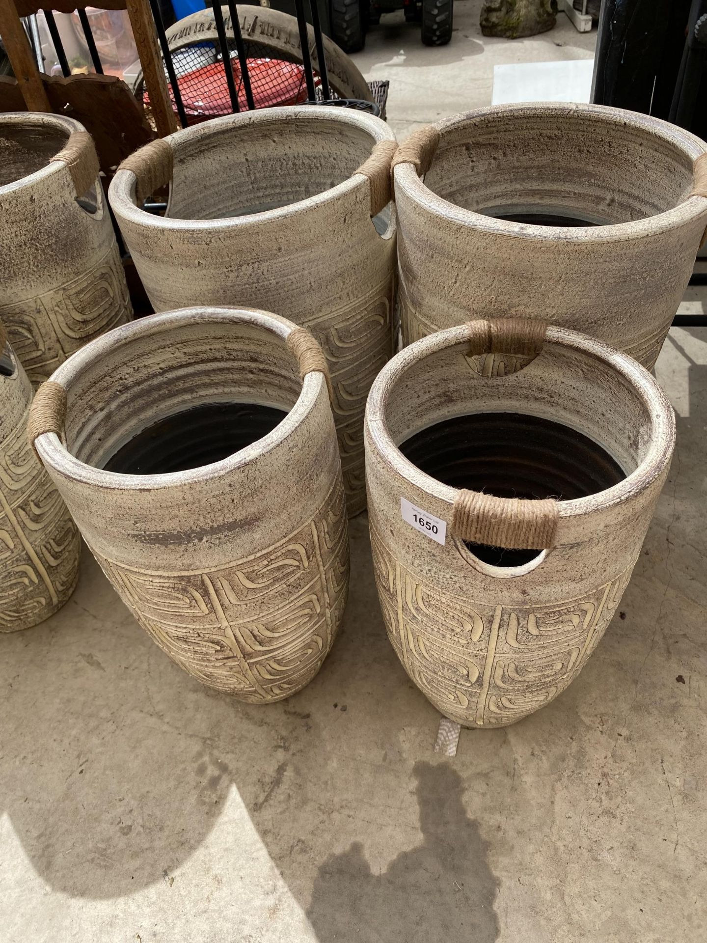 A SET OF FOUR AS NEW GRADUATED TWIN HANDLE TERRACOTTA PLANTERS (2 LRG AND TWO SMALL)