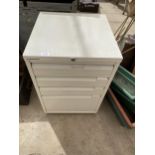 A FOUR DRAWER METAL FILING CABINET