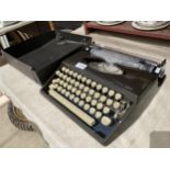 A RETRO ALDIS TIPPA S TYPE WRITER WITH CARRY CASE