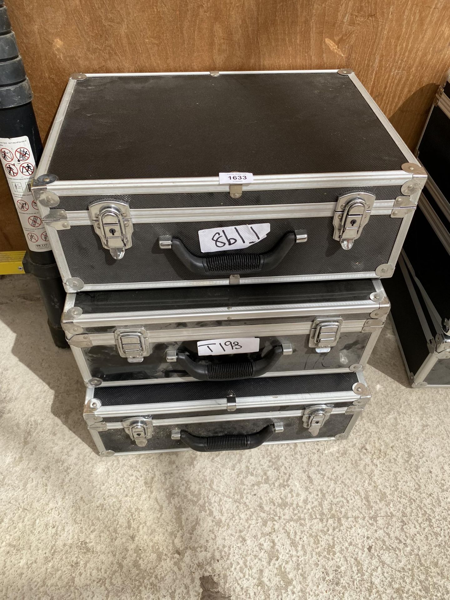 THREE HARD CASED BLACK STORAGE CASES