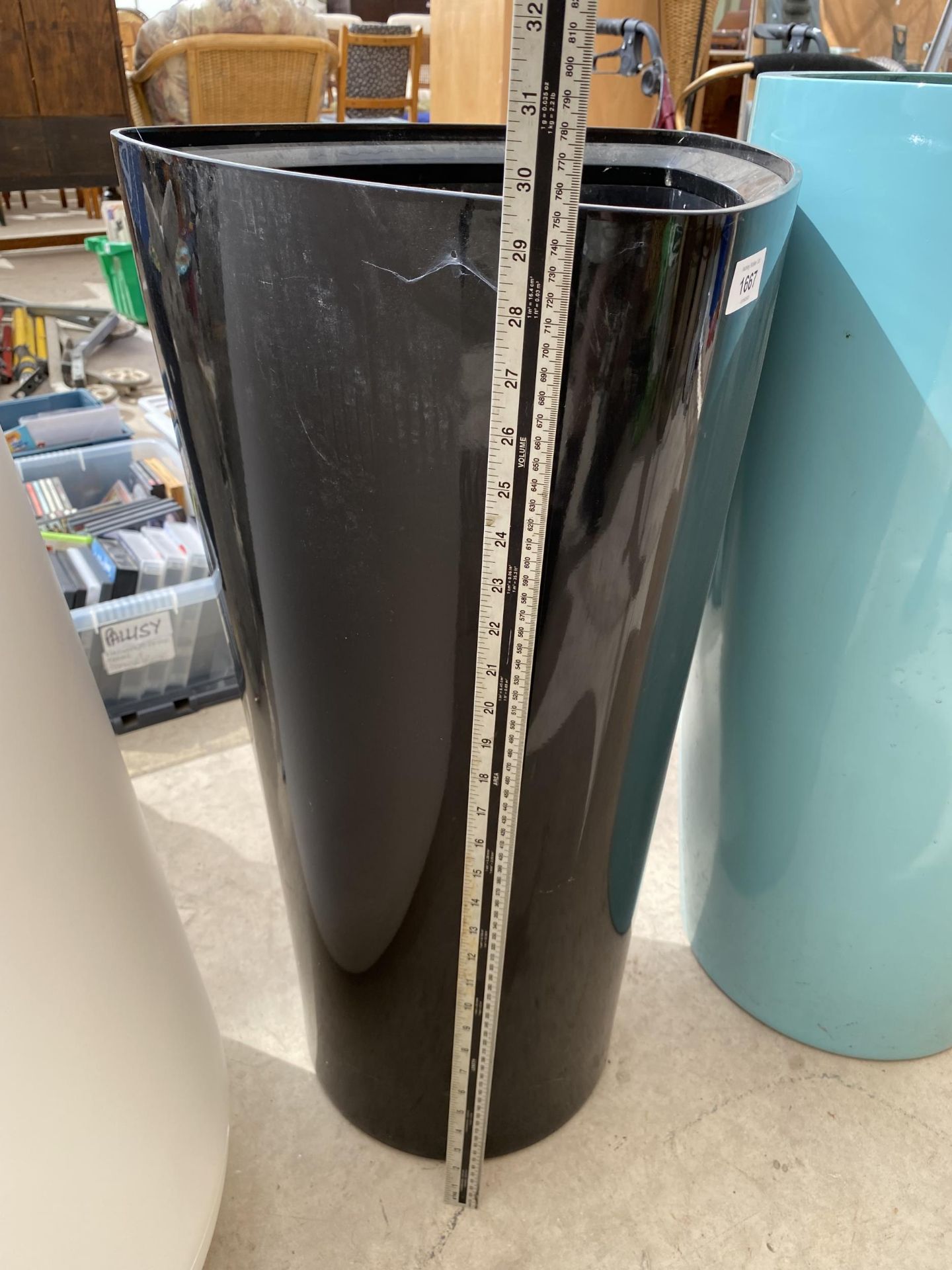 A BLACK TRIANGLUR PLASTIC PLANTER (H:75CM) - Image 2 of 3