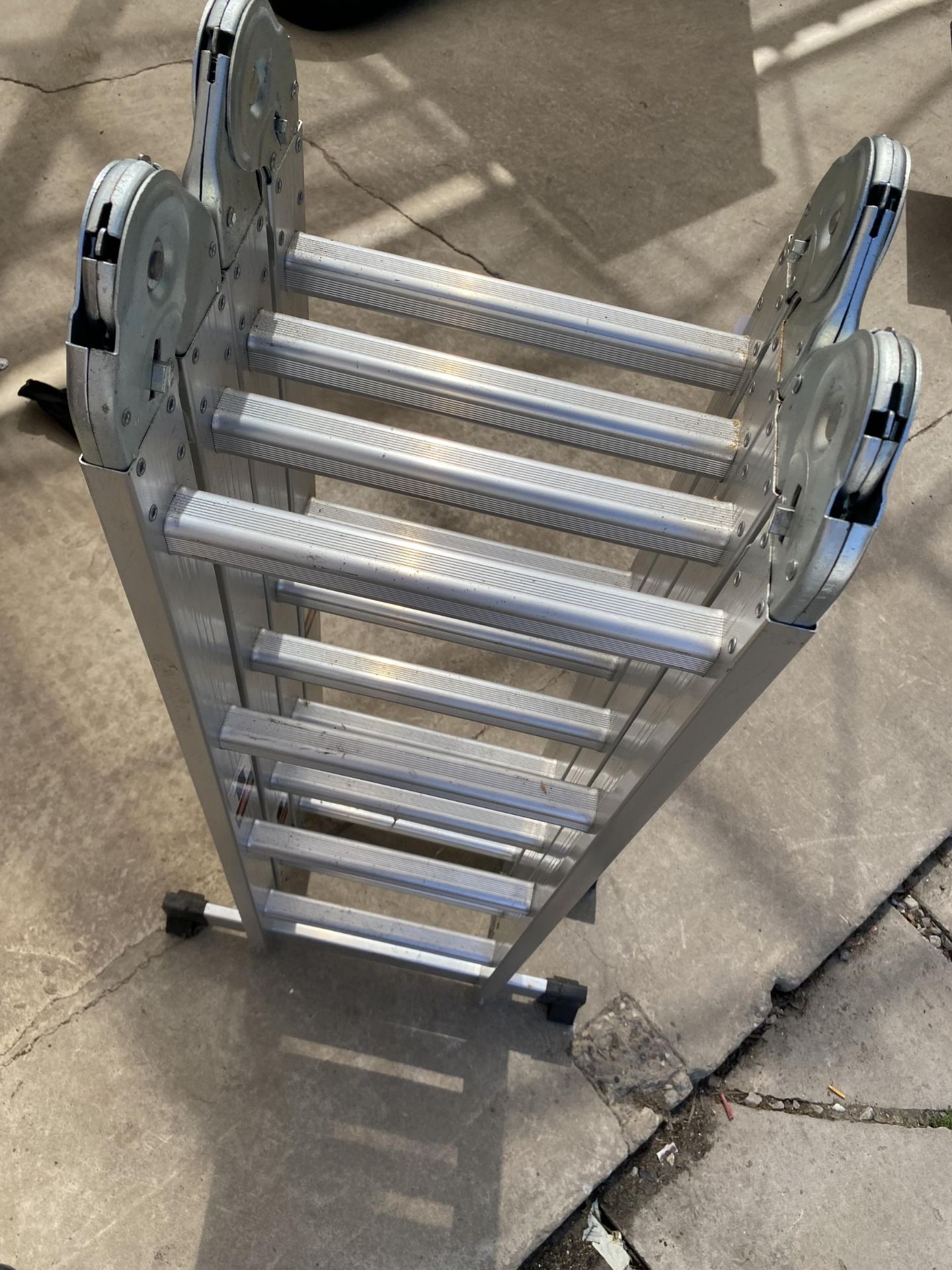 A FOUR SECTION MULTIFUNCTIONAL ALUMINIUM LADDER - Image 2 of 2