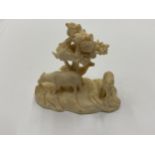 AN ORIENTAL BONE CARVED FIGURE