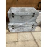 TWO GRADUATED GALVANISED METAL STORAGE TRUNKS