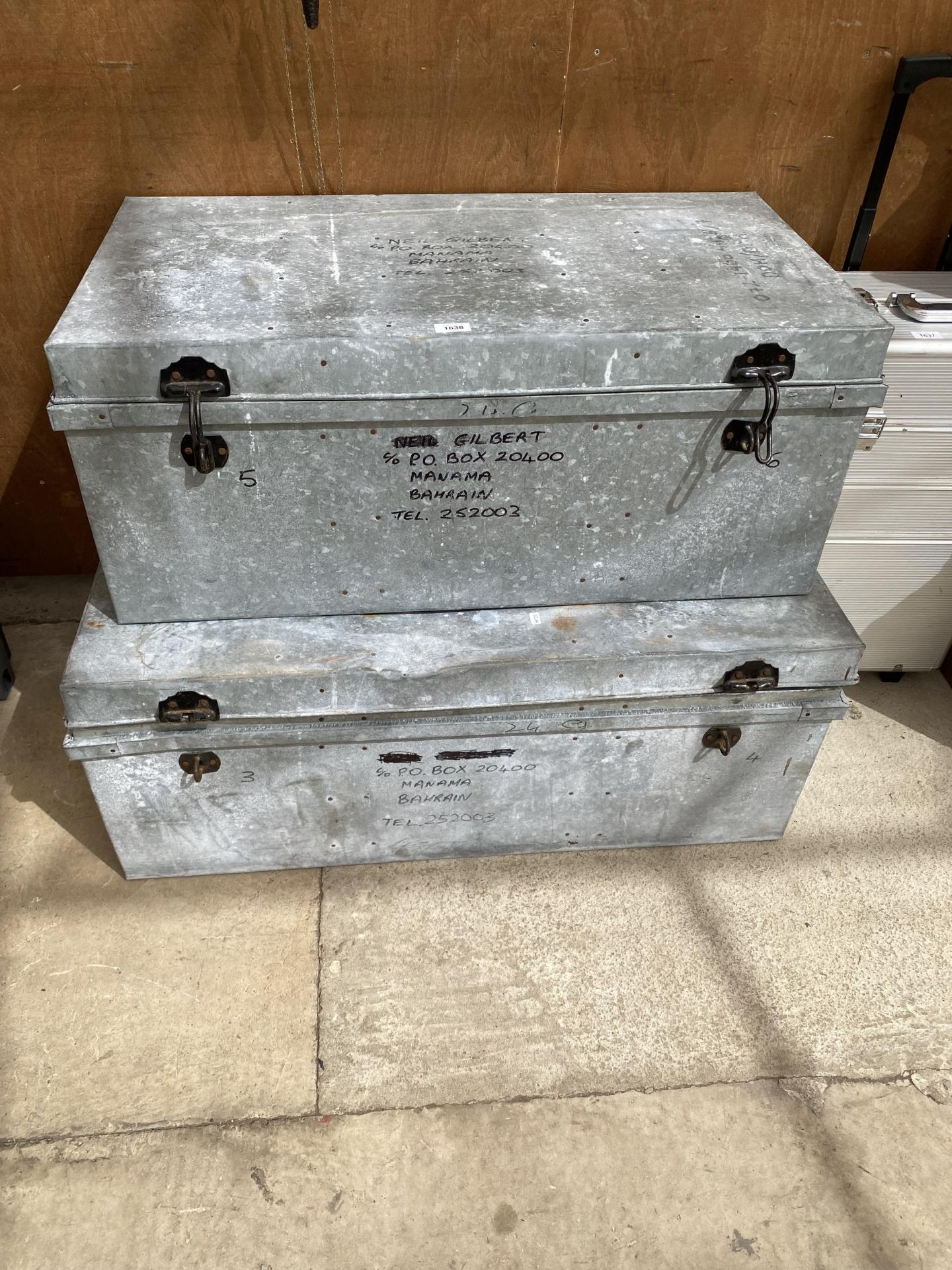 TWO GRADUATED GALVANISED METAL STORAGE TRUNKS