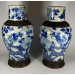 A PAIR OF EARLY 20TH CENTURY CHINESE BLUE AND WHITE CRACKLE GLAZE DRAGON DESIGN VASES, A/F, HEIGHT