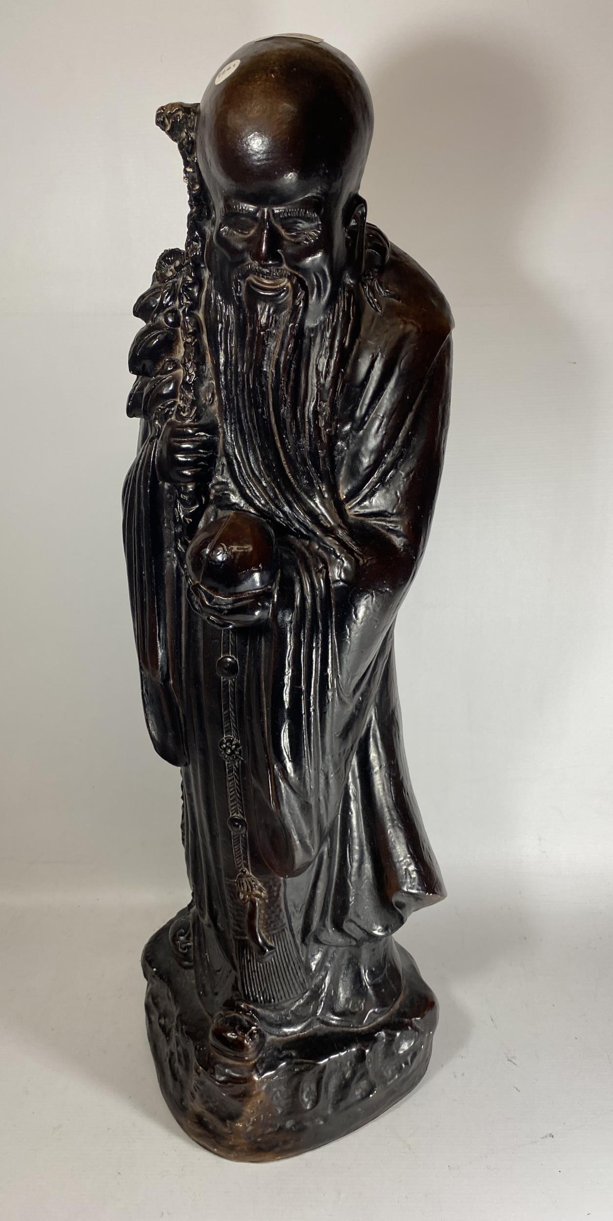 A LARGE METAL MODEL OF AN IMMORTAL, SIGNED AND DATED 1981 TO BASE, HEIGHT 81CM