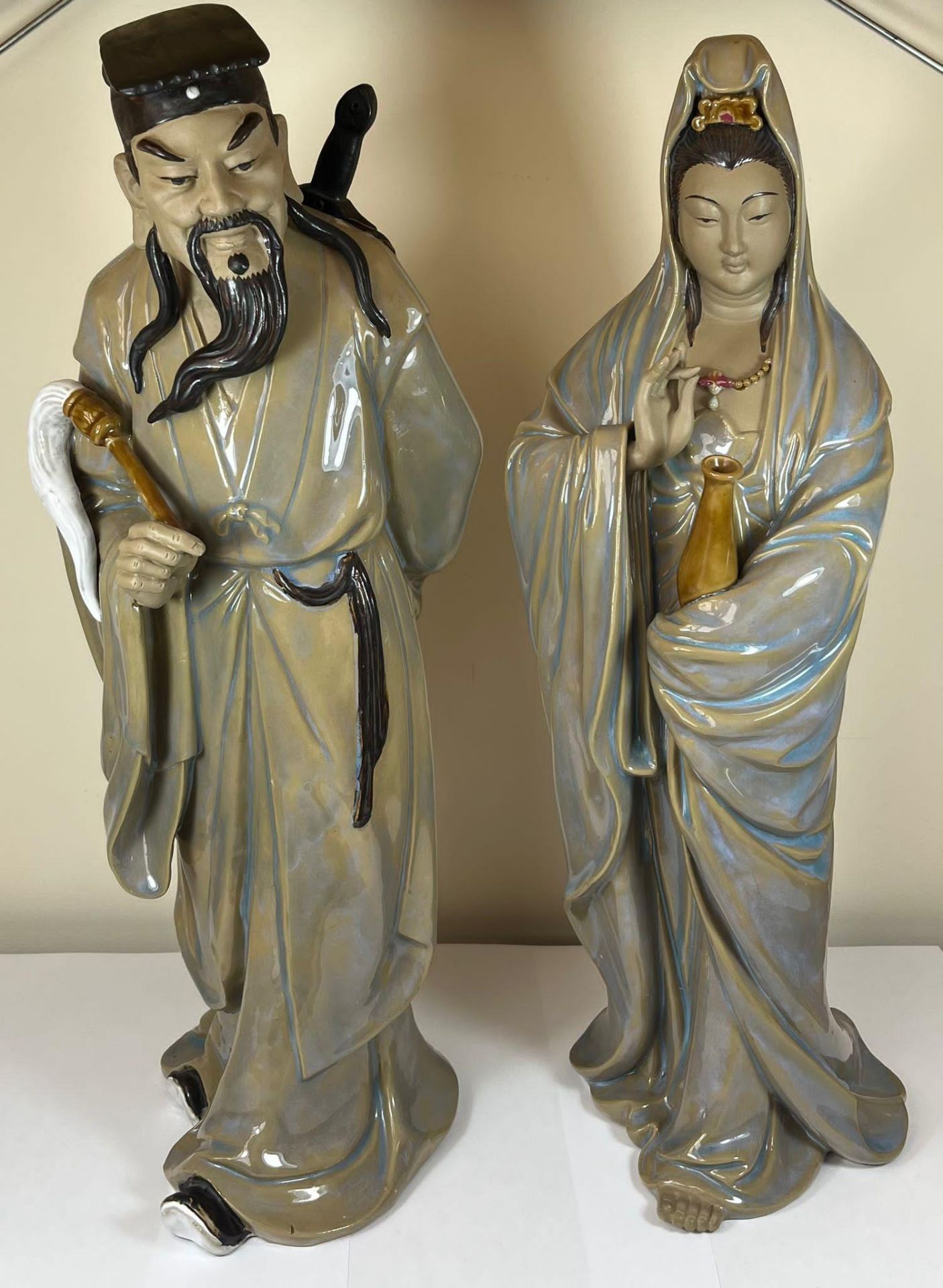 A LARGE PAIR OF CHINESE STONEWARE POTTERY IMMORTALS FIGURES - SCHOLAR IN ROBE AND GEISHA LADY,