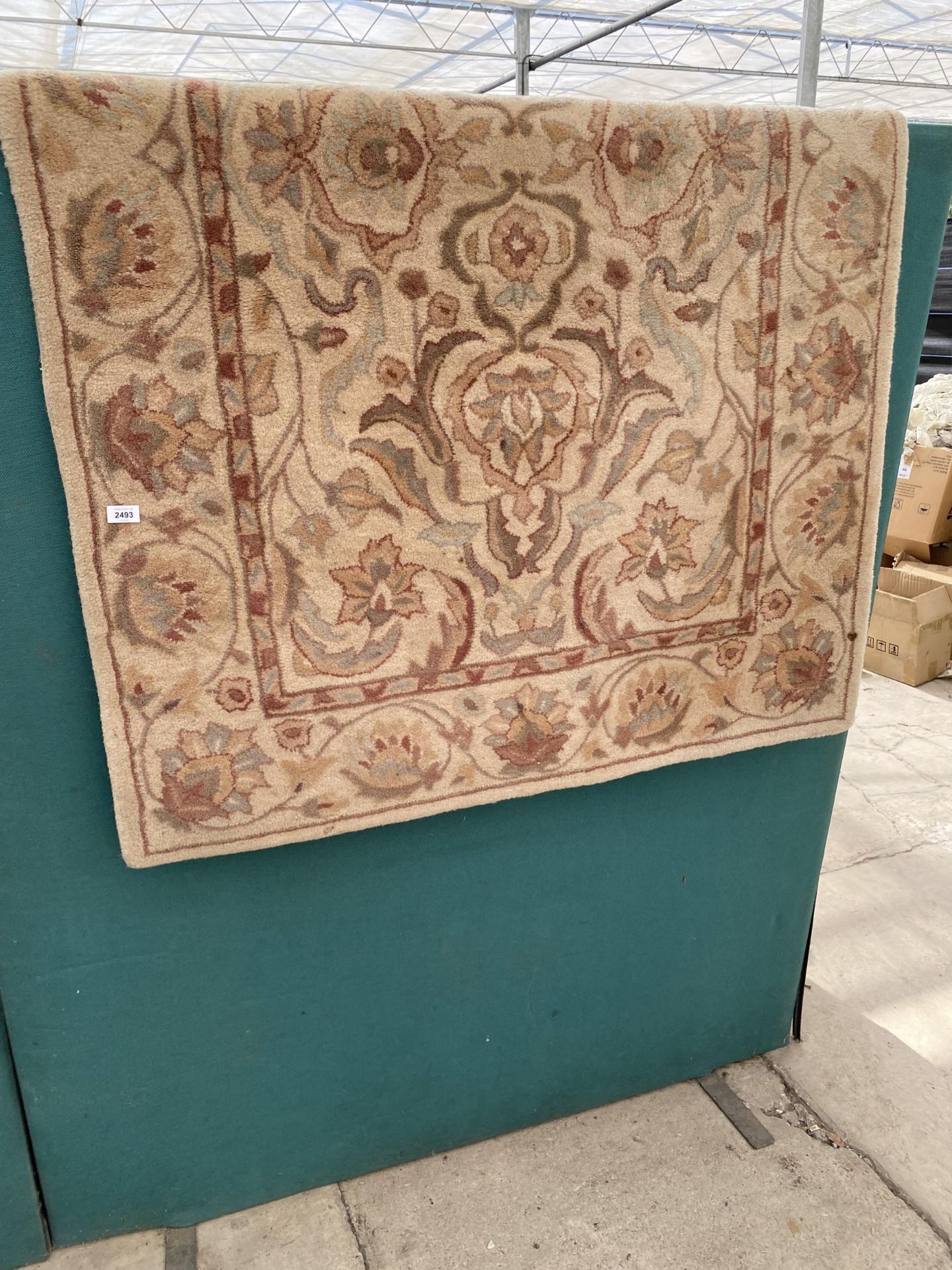 A CREAM PATTERNED RUG