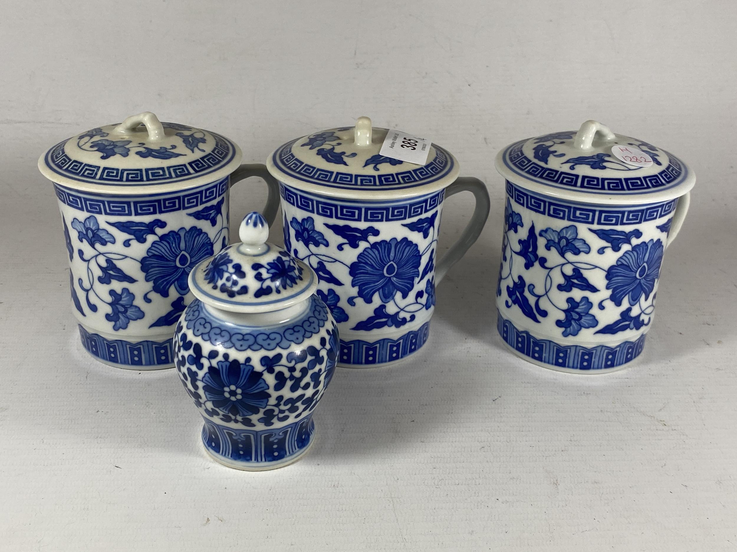 A GROUP OF MODERN CHINESE BLUE AND WHITE ITEMS - LIDDED JAR AND SET OF SIX LIDDED MUGS