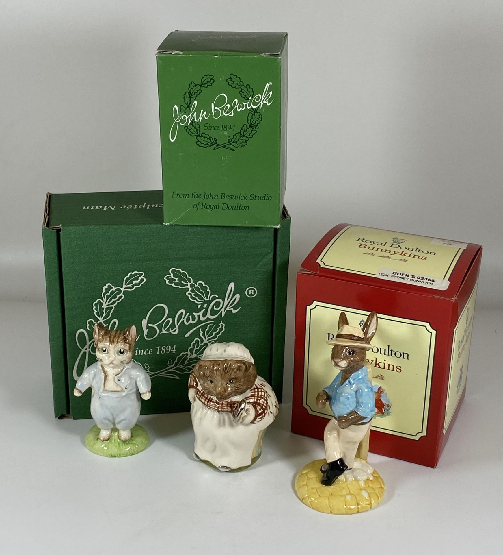 A GROUP OF THREE BOXED FIGURES, DOULTON BUNNYKINS AND TWO GOLD BACKSTAMP BESWICK BEATRIX POTTER