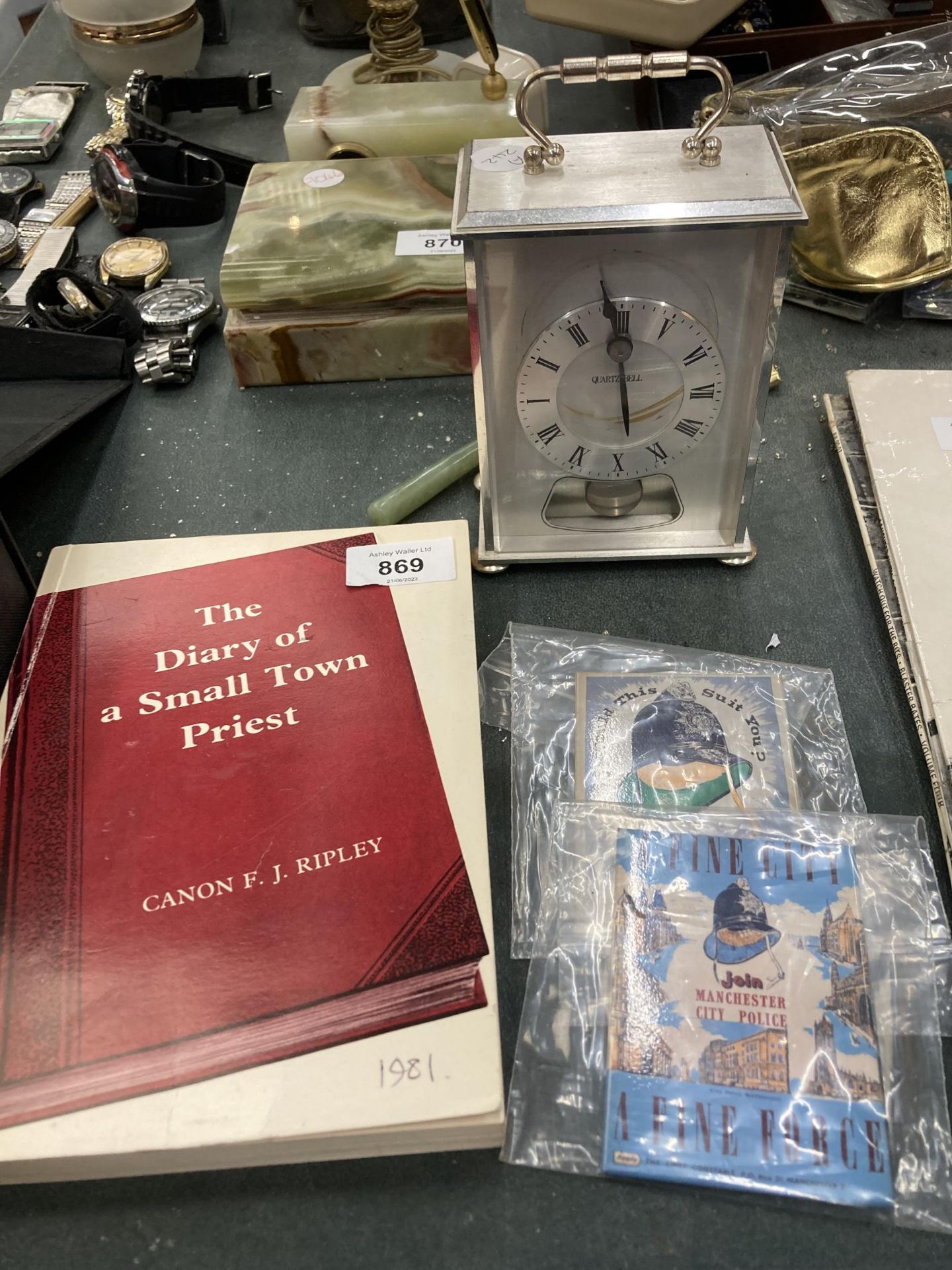 A WHITE METAL CARRIAGE CLOCK, MANCHESTER CITY POLICE MAGNETS PLUS 'THE DIARY OF A SMALL TOEN PRIEST'