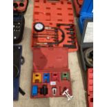 AN ASSORTMENT OF TOOLS TO INCLUDE A DISEL COMPRESSION GUAGE KIT ETC
