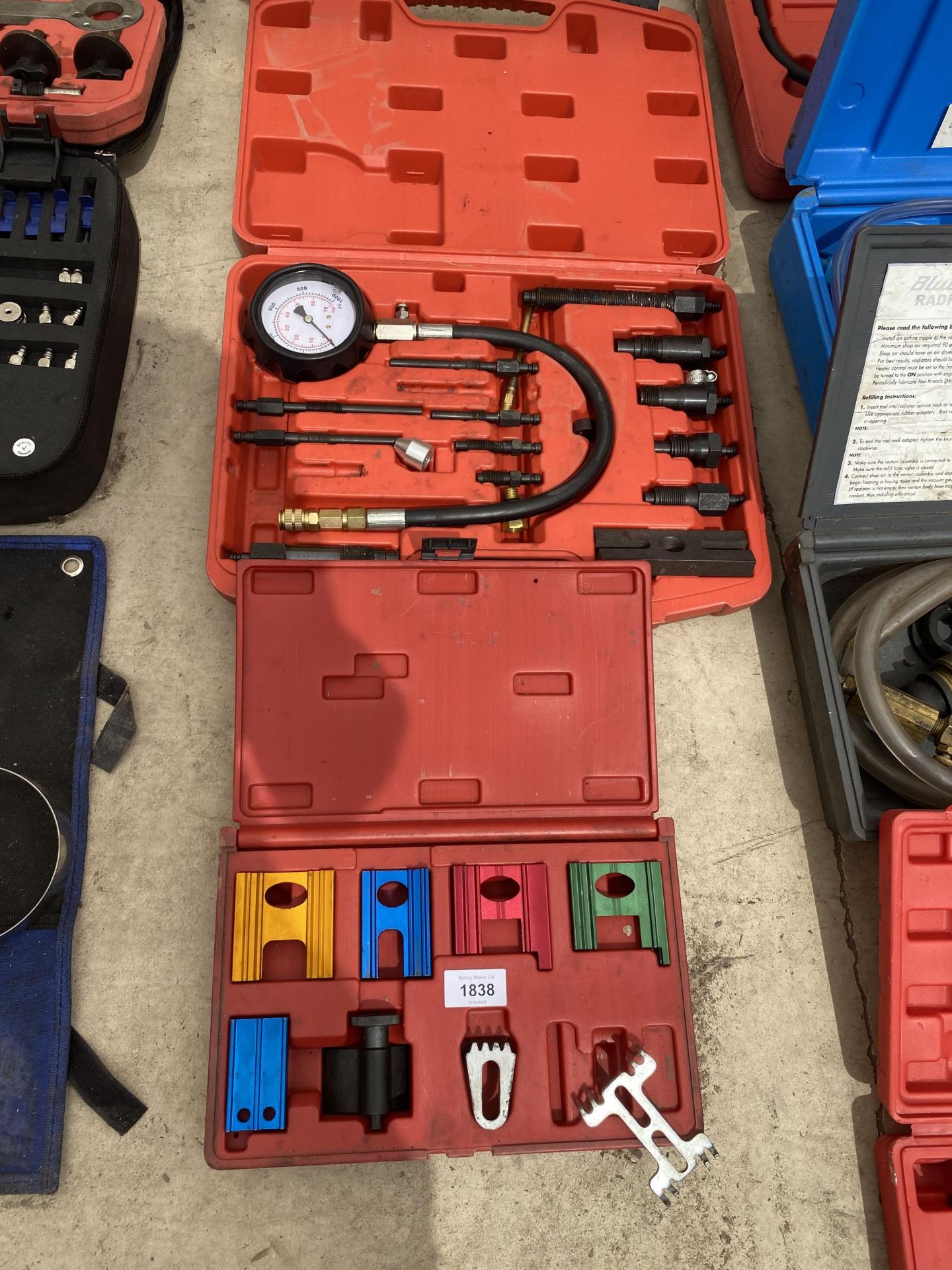 AN ASSORTMENT OF TOOLS TO INCLUDE A DISEL COMPRESSION GUAGE KIT ETC