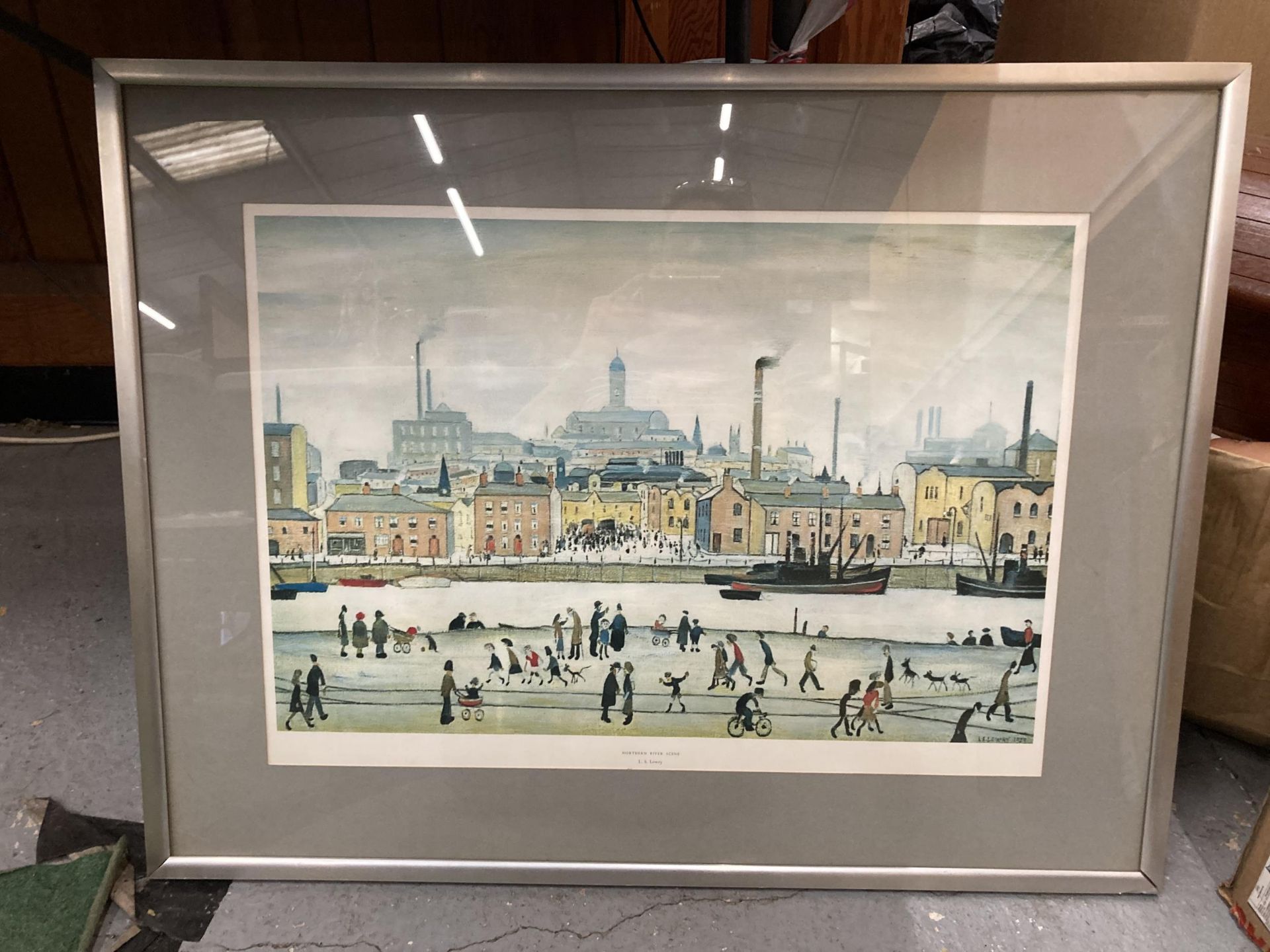 A FRAMED L.S LOWRY 'NORTHERN RIVER SCENE' PRINT