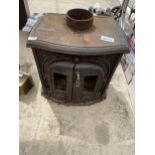 A VINTAGE CAST IRON LOG BURNER