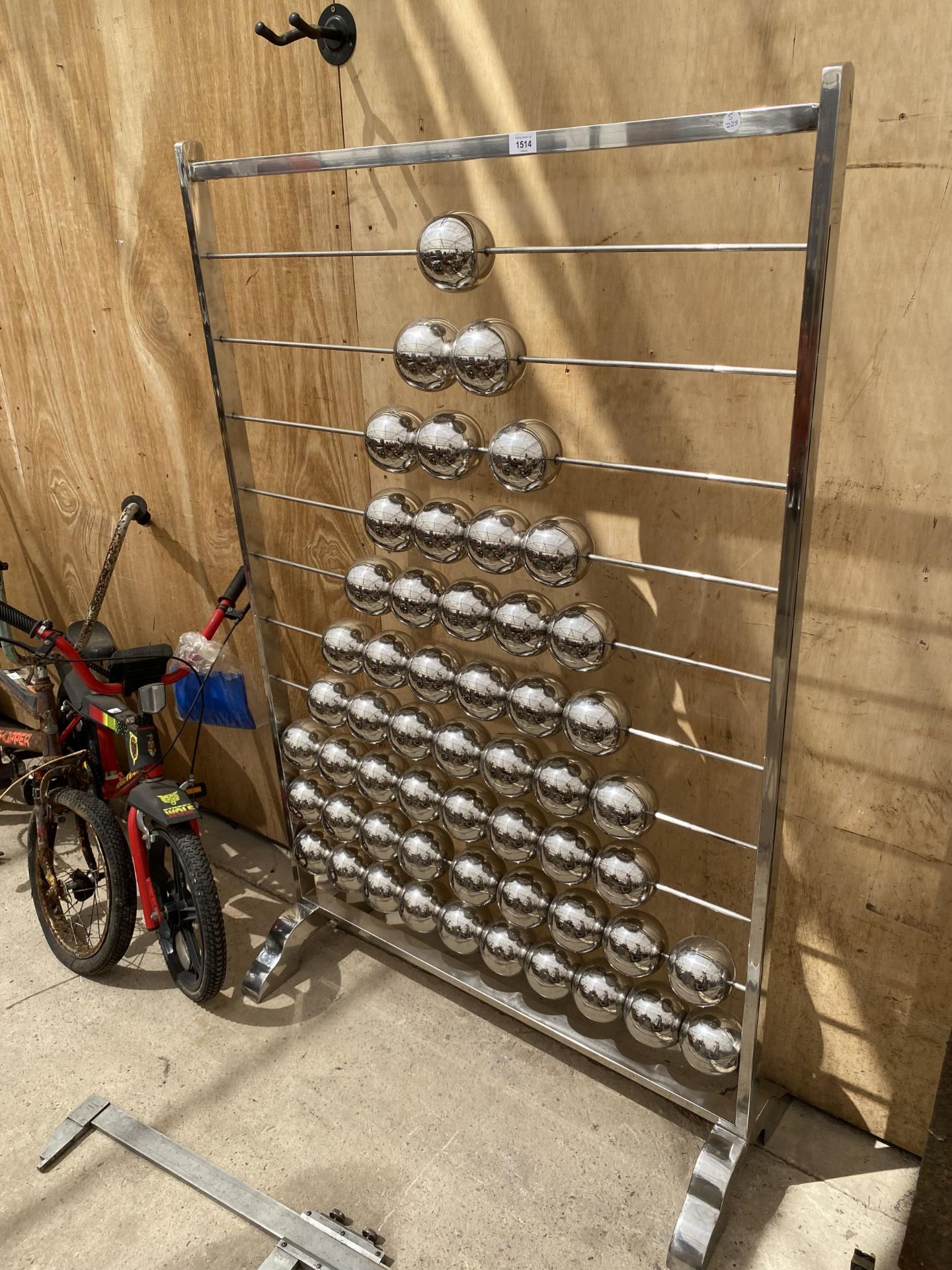 A LARGE STAINLESS STEEL ABACUS BY SAM AND SARA