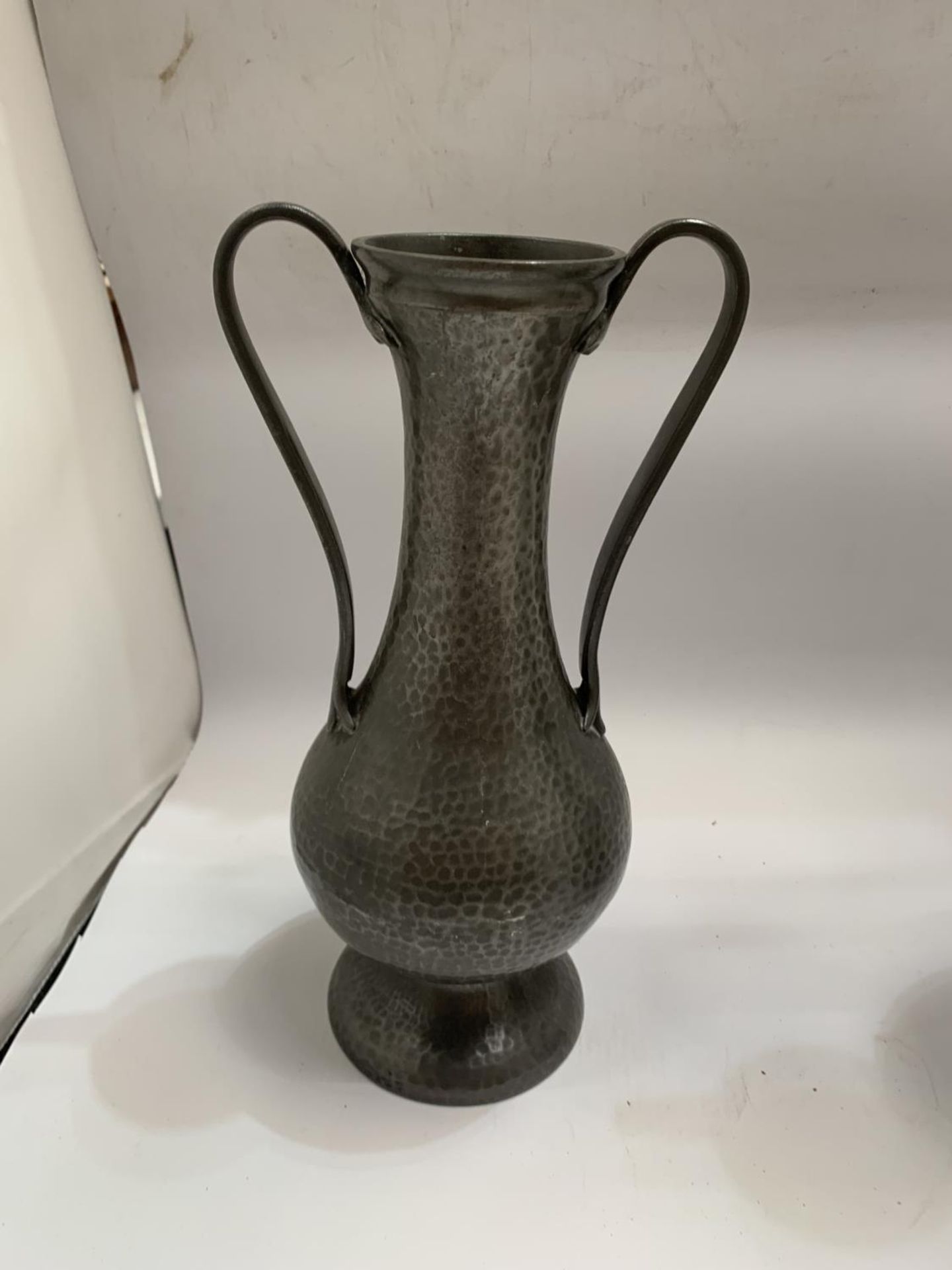 A PAIR OF ARTS AND CRAFTS STYLE TWIN HANDLED PEWTER VASES - Image 2 of 3