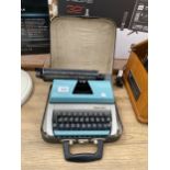 A RETRO TYPEWRITER WITH CARRY CASE