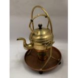 A VINTAGE BRASS AND COPPER SPIRIT KETTLE