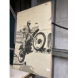 A LARGE PRINT OF ONE OF THE ROYAL ARTILLARY DISPLAY TEAM MOTORCYCLISTS