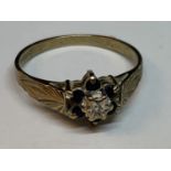 A 9 CARAT GOLD RING WITH A CENTRE DIAMOND SURROUNDED BY SAPPHIRES SIZE M