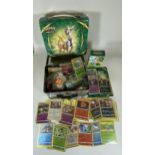 A POKEMON TIN TRAINER BOX FULL OF CARDS, GAME COUNTERS, RARES, HOLOS ETC