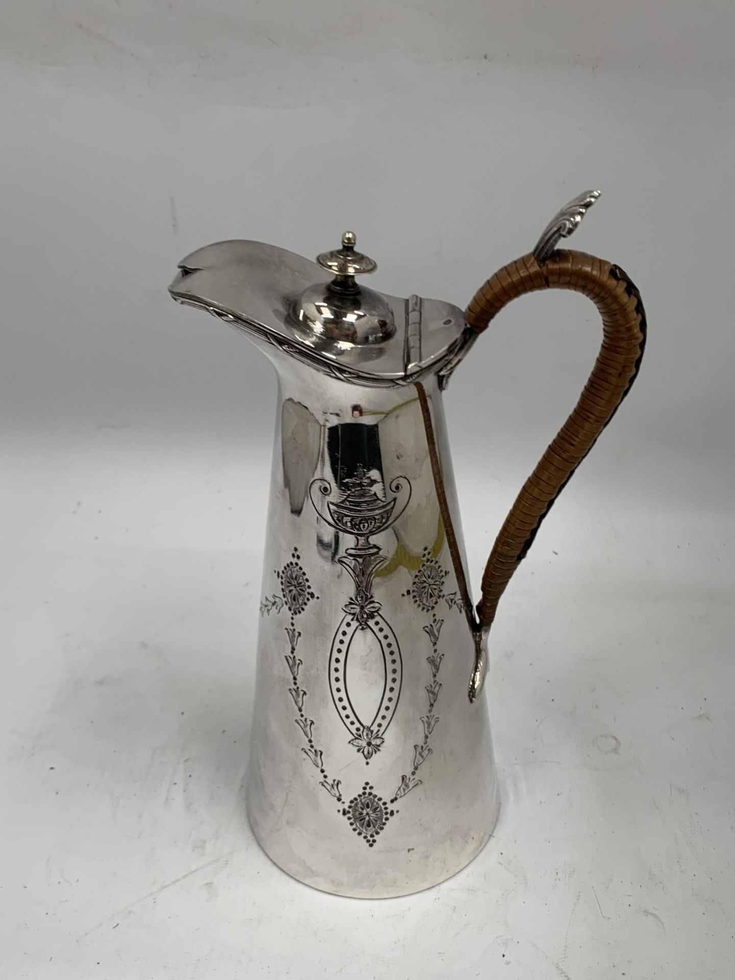 A VINTAGE SILVER PLATED WATER JUG