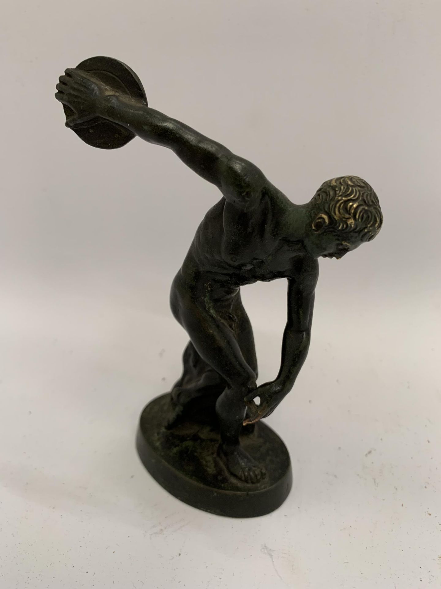 A BRONZE MODEL OF ACHILLES THROWING A DISCUS