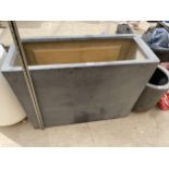 A GREY RECTANGULAR FIBRE GLASS TROUGH PLANTER (90CM x 70CM x 35CM)