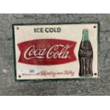 A CAST COCA COLA SIGN