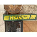 A WOODEN 'VEGANTUNE' SIGN