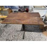 A WOODEN TOPPED PUB TABLE WITH CAST IRON BASE