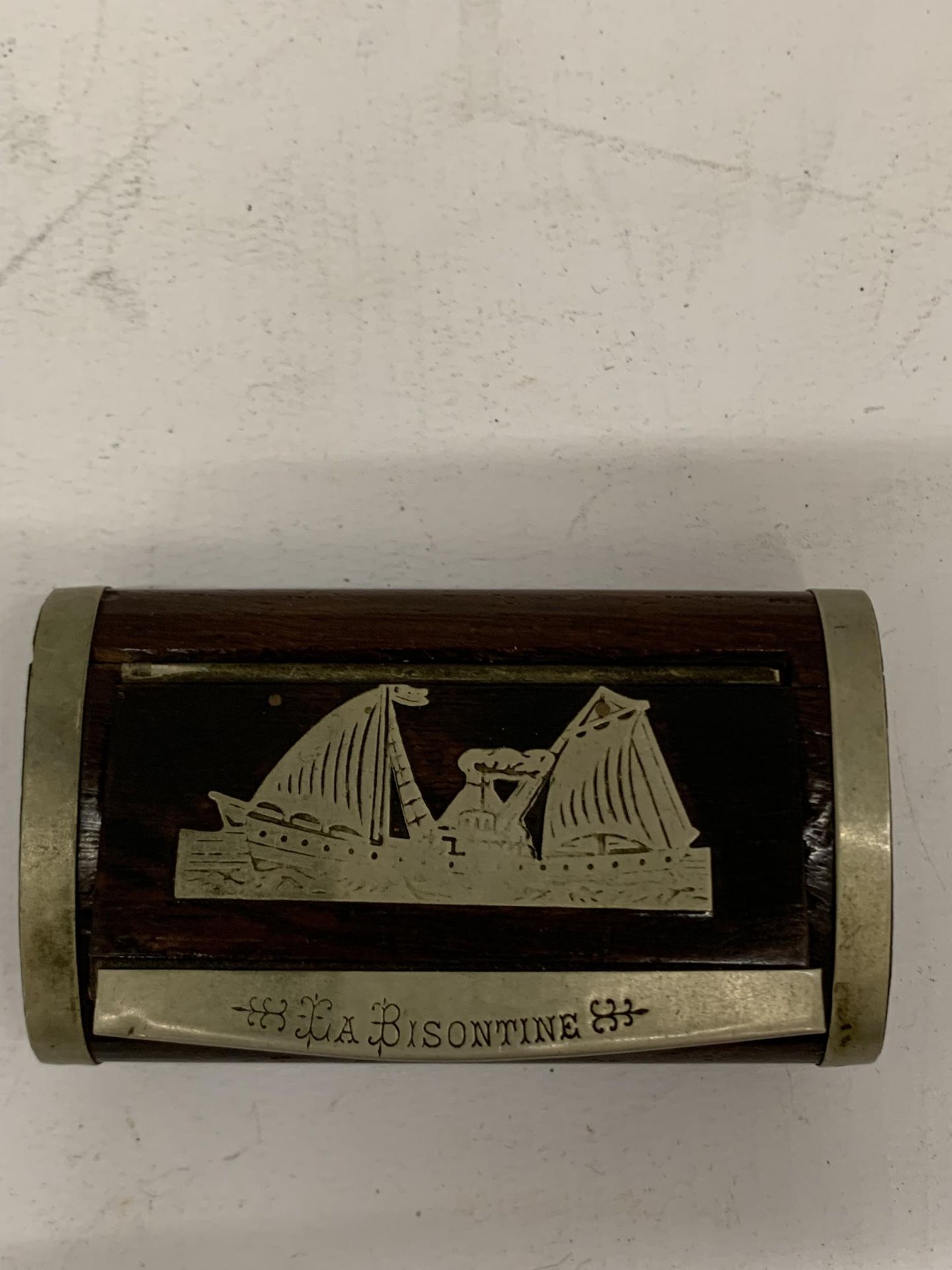 A VINTAGE BISONTINE WOODEN AND METAL BOUND SNUFF BOX