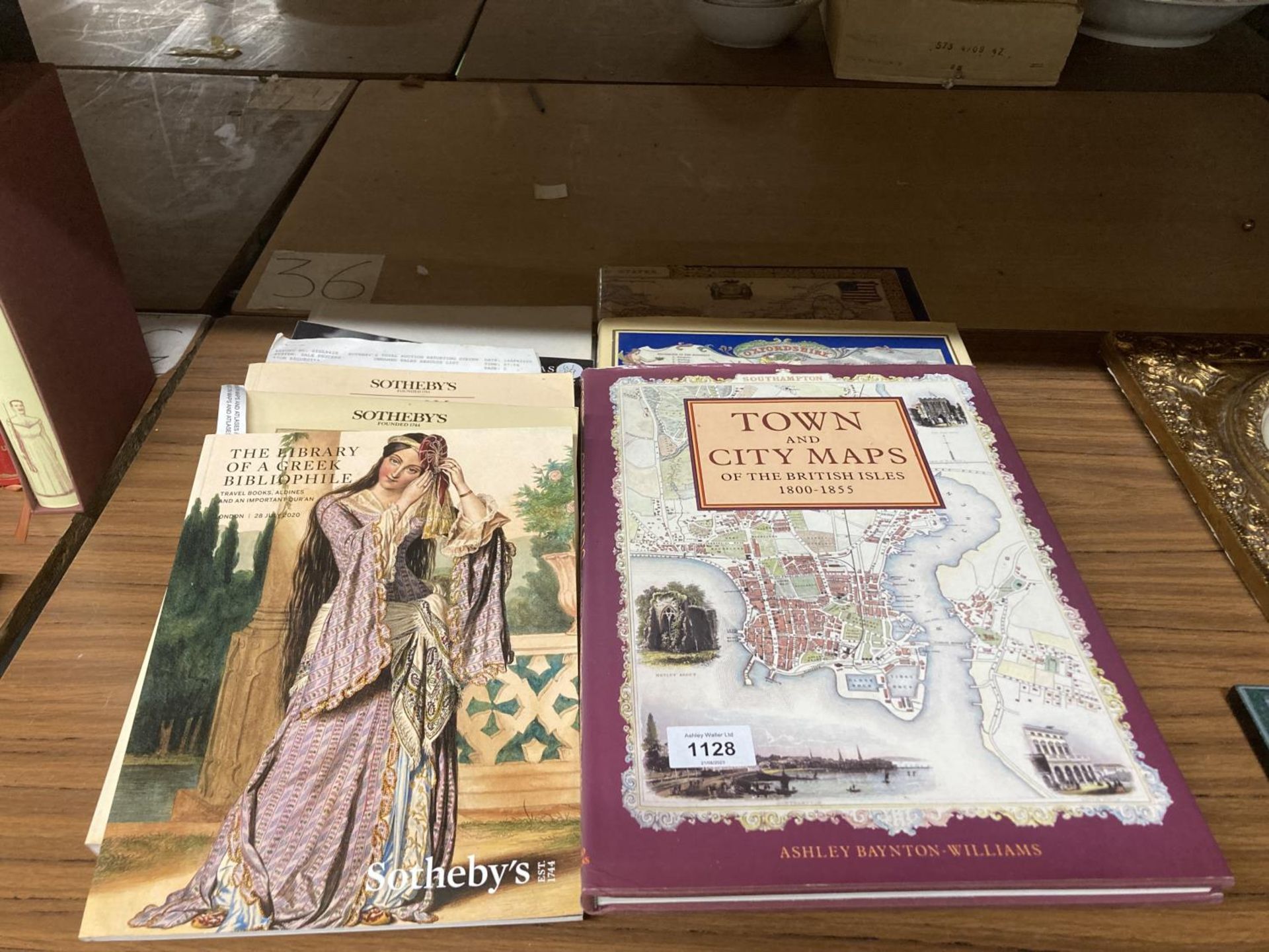 A COLLECTION OF BOOKS, SOTHEBYS CATALOGUES, TOWN AND CITY MAPS ETC
