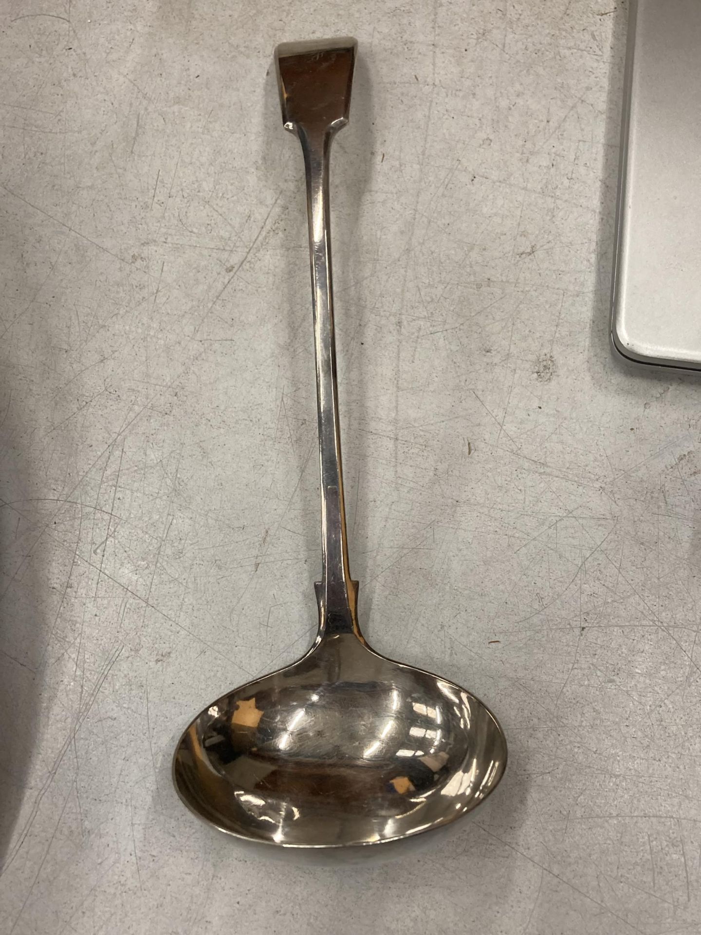A LARGE SILVER PLATED LADLE