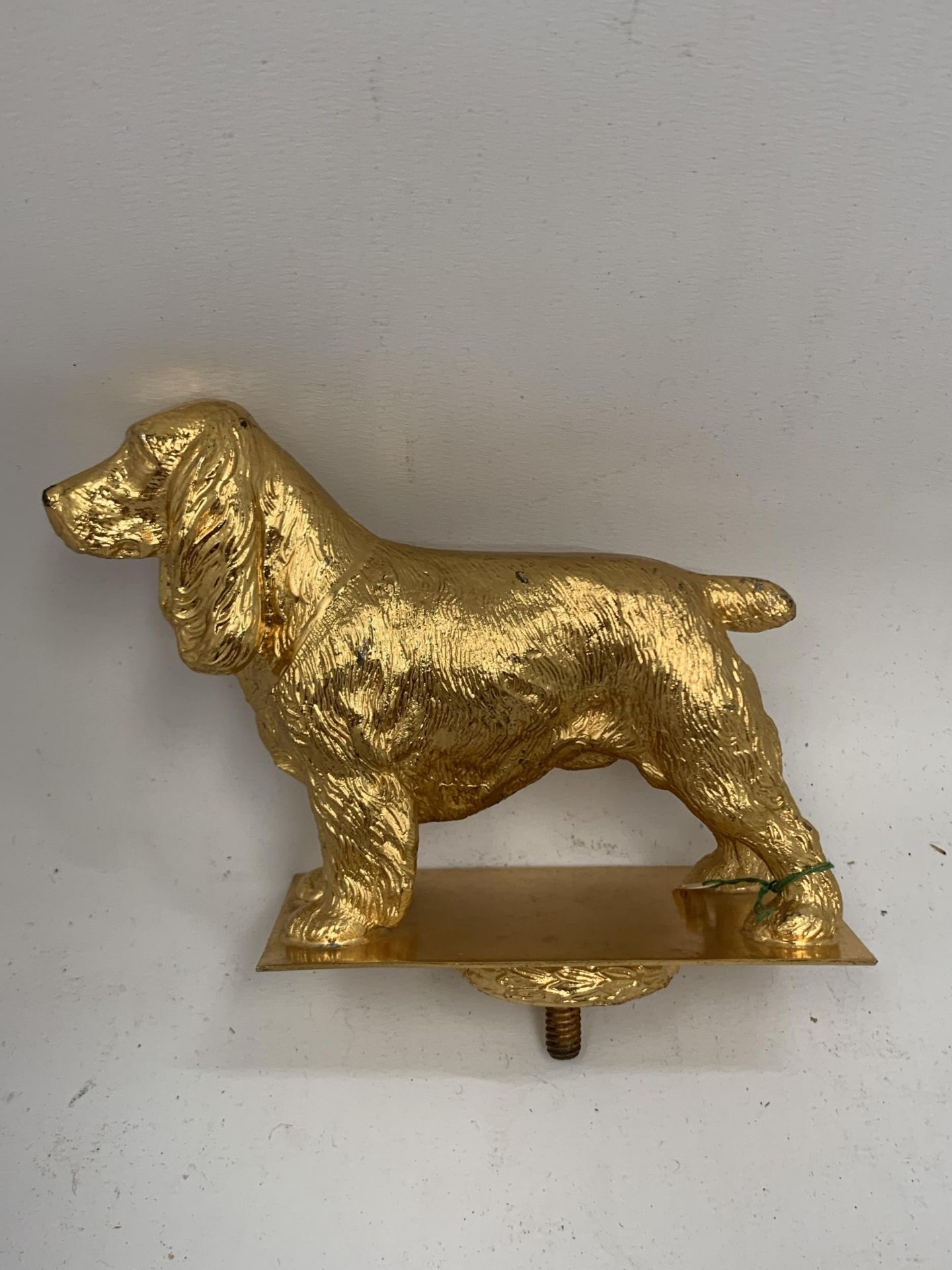 A VINTAGE GOLD PAINTED COCKER SPANIEL DOG MASCOT